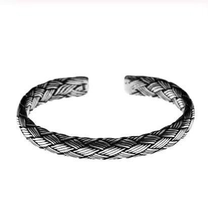 Woven Whispers: The Silver Cuff of Unity