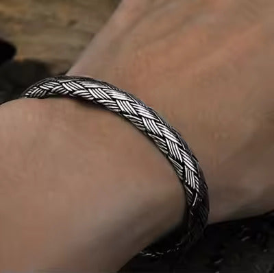 Woven Whispers: The Silver Cuff of Unity