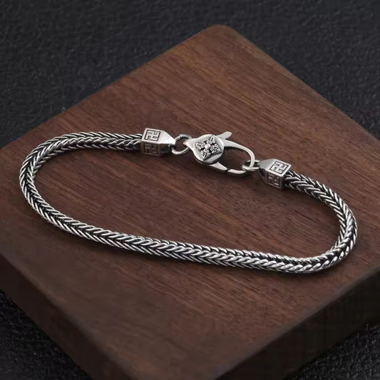 Ethereal Weave: The Silver Braided Bracelet