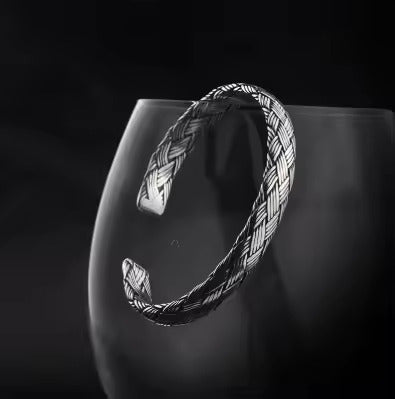 Woven Whispers: The Silver Cuff of Unity